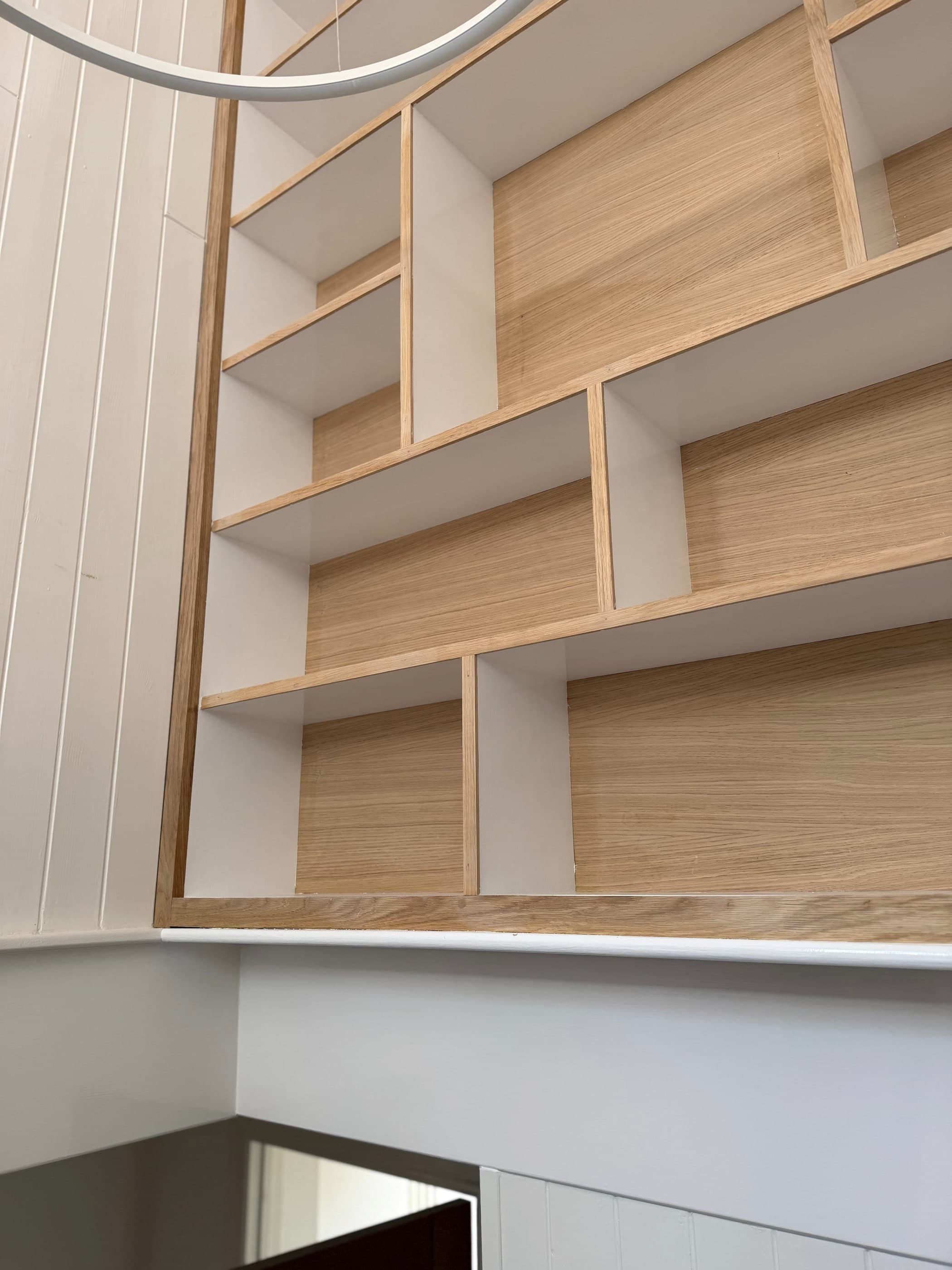 Bespoke oak alcove shelving with painted backs
